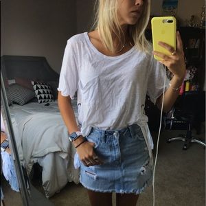 White t-shirt with cross stitching on the side